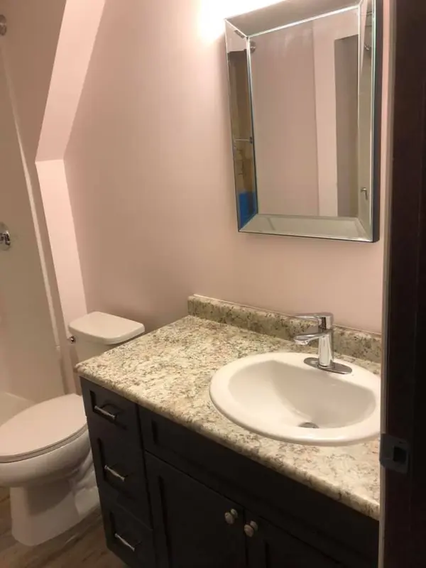 Newly installed vanity cabinet and sink counter