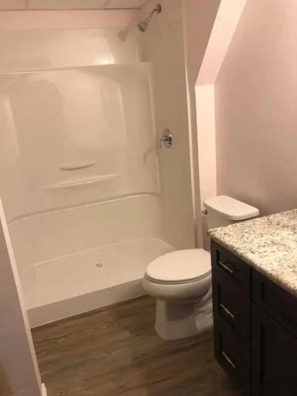 Finished bathroom showing the new shower space