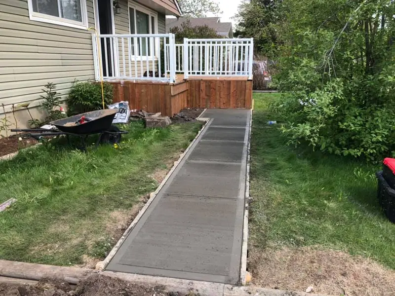 Wide view of the new sidewalk leading to the front porch