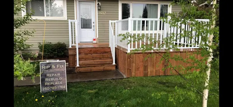 New wooden staircase and white railing on a front porch