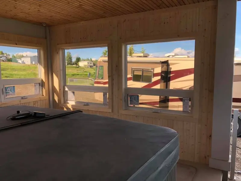 Inside a new spa room addition showing wood-finished interior walls